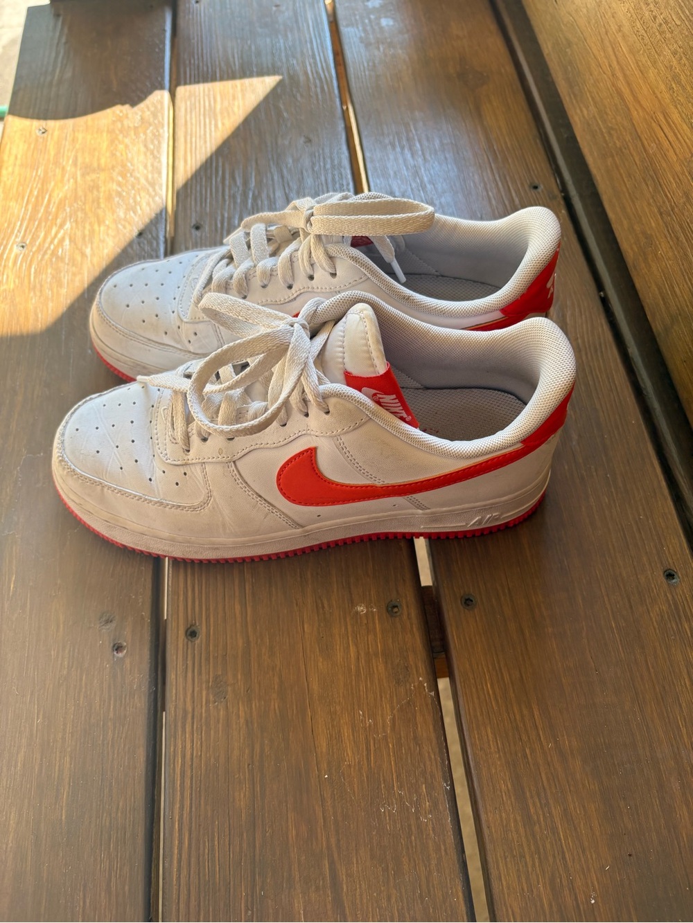 Nike Kids White Sneakers with Red Swoosh
